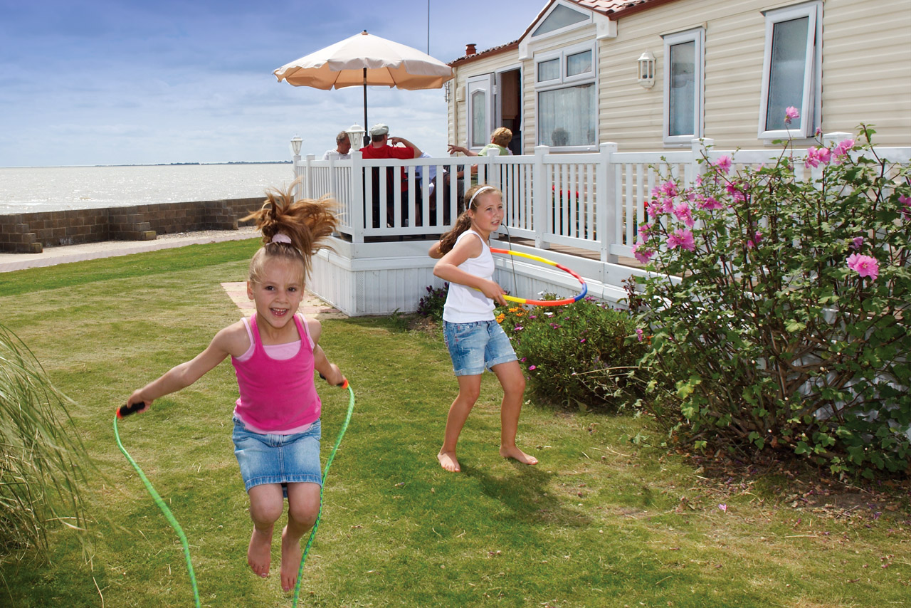 Home 2 Caravan Hire Kids Playing Outside Caravan